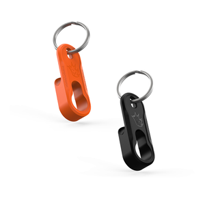 Orange and black keychain bottle openers on a white background